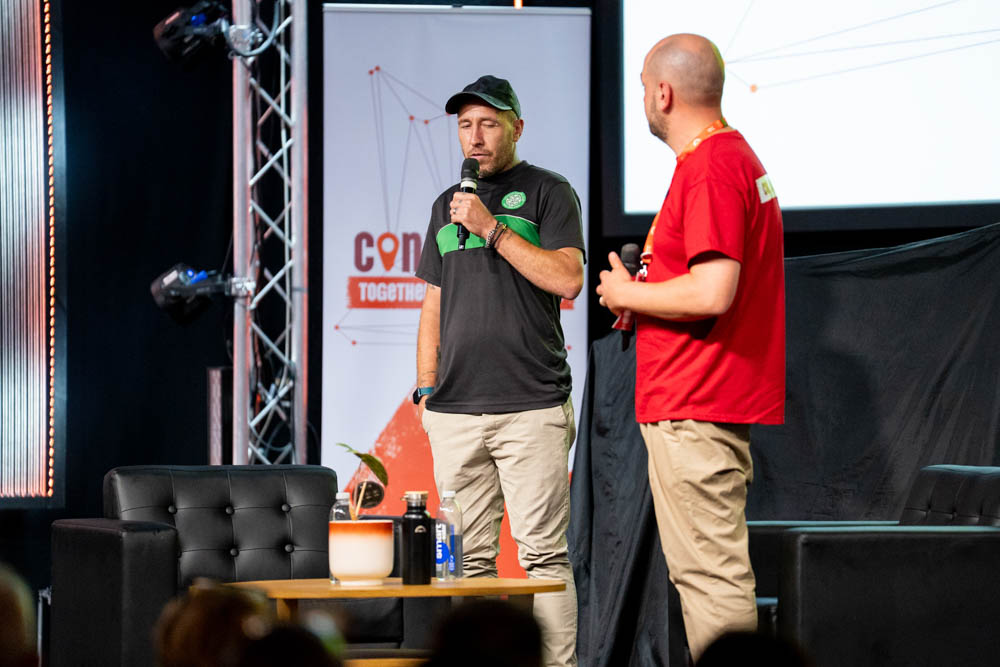 A Langley client on stage sharing his story