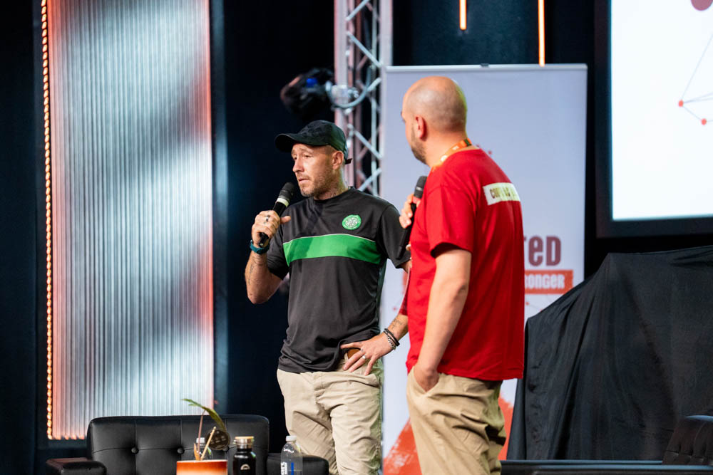 A Langley client on stage sharing his story